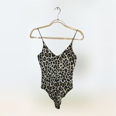 Gaze Clothing Spaghetti Strap Leopard Print Bodysuit Size Xs Measurements Armpit To Armpit 14" Length 21" Chic White Bodysuit With Spaghetti Straps, Fitted Spaghetti Strap Tank Top For Beachwear, Summer Sleeveless Bodysuit With Adjustable Straps, Summer V-neck Lined Camisole, Trendy Fitted Camisole For Vacation, Summer Camisole With Spaghetti Straps And Lined Body, Summer Camisole With Lined Body And Spaghetti Straps, Vacation Bodysuit With Spaghetti Straps And Built-in Bra, Summer Fitted Camisole For Loungewear