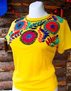 "Mexican embroidered shirt Beautiful embroidered blouse. This is handmade in Mexico. Perfect for those summer days at the beach, or for your fiesta parties. The embroidery colors may vary due all the handmade work (not the design). If you want an specific color, please send us a message so we can send you the ones available so you can choose. Size: Extra Small: 13\" width x 22\" long Small; 14\" width x 23\" long Medium: 15 1/2\" width x 24\" long (Width: shoulder - shoulder) Please also notice Mexican Embroidered Shirt, Mexican Party Favors, Mexican Wall Decor, Mexican Clothing, Mexican Flowers, Mexican Blouse, Mexican Outfit, Mexican Decor, Fiesta Party