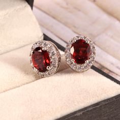 This Sterling Silver Jewelry set features an Elegant Art With Natural Garnet Gemstone. The cavity is made from genuine solid 925/92.5 Sterling silver and stamped as S925. This Jewelry is Lead free and Rhodium plated to prevent scratches and tarnish. ITEM DESCRIPTION Item Code: JACB31 Metal: 925/92.5 Sterling Silver Gemstone: Genuine Natural Garnet Gemstone Shape: Oval Gemstone Size: 7X9 MM Ring Dimension:- Length: 13 MM Width: 11 MM Weight: 2.88 gm approx Earrings Dimension:- Length: 13 MM Width Classic Round Jewelry For Valentine's Day, Sterling Silver Jewelry With Prong Setting For Valentine's Day, Oval Fine Jewelry For Valentine's Day, Classic Gemstone Jewelry For Valentine's Day, Silver Halo Setting Jewelry For Valentine's Day, Exquisite Ruby Jewelry With Halo Setting, Elegant Ruby Jewelry With Halo Setting, Dazzling Gemstone Jewelry For Valentine's Day, Sterling Silver Gemstone Earrings For Valentine's Day