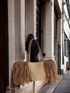 *With this straw bag you will always be stylish for everyday use, at the beach and wherever you want. *       Bag dimension 64x30 cm (widthxheight)  (25,19x 11,81 inches)  *      Bags full height is 61 cm - 24.01 inch                                            *Our bag is hand knitted, embroidered with paper string and lined with fabric. The tassel image is made with raffia rope. *It has a huge capacity and is strong enough to carry your belongings. *      With this bag you will attract all eyes Trendy Fringe Vacation Bag, Trendy Vacation Bag With Fringe, Trendy Natural Bag With Fringe, Trendy Fringe Shoulder Bag For Vacation, Trendy Vacation Shoulder Bag With Fringe, Chic Beige Fringe Shoulder Bag, Casual Natural Bags With Fringe, Trendy Crochet Bag With Tassels For Beach, Trendy Beige Shoulder Bag With Fringe