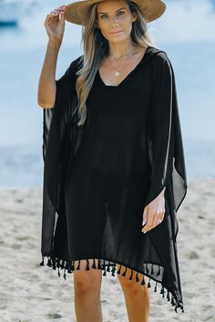 Black Tassel Hooded Oversized Beach Cover Up Oversized Black Summer Poncho, Black Poncho For Summer, Black Long Sleeve Poncho For Beach, Casual Summer Poncho With Fringe, Black Long Sleeve Beach Poncho, Oversized Black Bohemian Cover-up, Casual Vacation Cover-up With Tassels, Casual Black Summer Poncho, Black Bohemian Poncho For Summer