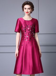 Presenting an exquisite mother of the bride dress that combines sophistication with modern design. The rich magenta color of this dress is both elegant and vibrant, perfect for a memorable occasion like a wedding. The bodice is beautifully embellished with sequins and beads, adding a glamorous sparkle that catches the light. The short sleeves and rounded neckline feature delicate details, enhancing the dress's overall appeal. The A-line silhouette flatters all body types, providing comfort and a Festive A-line Evening Dress For Wedding, Elegant A-line Evening Dress For Mother Of The Bride, Elegant Purple A-line Gown, Elegant Purple Wedding Guest Gown, Elegant Satin Evening Dress For Mother Of The Bride, Elegant Festive A-line Gown, Elegant Pink Evening Dress For Mother Of The Bride, Gala Mother Of The Bride Dress For Banquet, Elegant Pink Mother Of The Bride Evening Dress