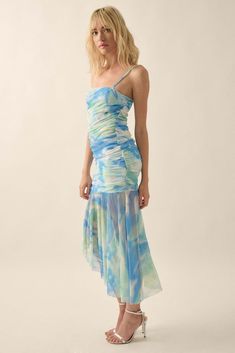 Tie-dye print mesh midi dress. Drop-waist design. Straight neckline. Ruched bodice. Sleeveless with adjustable cami straps. Low back. Partial thigh-length lining. Asymmetrical, raw-edge ruffle hem. Calf length. Fitted silhouette. 95% Polyester, 5% Spandex. Imported. Designed in LA. Model wears size S. Summer Mesh Dress With Ruched Spaghetti Straps, Blue Summer Dress With Ruched Bodice, Fitted Ruched Mesh Dress For Summer, Summer Fitted Mesh Dress With Ruched Bodice, Summer Mesh Dress With Spaghetti Straps And Ruched Detail, Blue Midi Dress With Ruched Bodice For Summer, Fitted Tie Dye Maxi Dress For Spring, Fitted Blue Mesh Dress For Spring, Chic Blue Mesh Dress For Spring