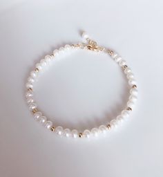 "* DETAILS * - Freshwater Pearl Potato Shape White Pearls Size Approx.5mm - 14k Gold Filled Beads 3mm - All components are 14k Gold Filled 👉🏻 Fits wrist size from 6\" to 7.5\" * CARE TIPS * ⭐️TO PREVENT TARNISH:Keep your jewellery in airtight plastic bags. It won't tarnish if it isn't exposed to air. The worst place to leave your jewellery is in a steamy bathroom. Wipe with a soft cloth after wearing. - Perfumes: Be sure any perfume or lotions are completely absorbed into skin. - Hair products Toggle Clasp Bracelet, Wear Perfume, Skin Hair, Mother Birthday Gifts, Bridal Bracelet, Bracelet Clasps, Plastic Bags, Photo Bracelet, Pearl Size