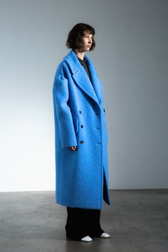 Drop-shoulder coat, virgin wool, sky blue. Crafted in soft alpaca and luxe virgin wool, this sky blue statement coat epitomizes femininity imbued with playfulness. Accented by pleated dropped-shoulders, it creates a fierce, unexpected silhouette. Chic Blue Wool Coat, Blue Wool Long Coat, Blue Long Wool Coat For Work, Chic Blue Wool Coat For Winter, Chic Blue Wool Outerwear, Chic Blue Wool Coat For Fall, Drop Shoulder Coat, Fall 2023 Fashion, Blue Crafts