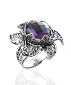 Looking for a stunning and versatile piece of jewelry that's perfect for any occasion? Look no further than The Filigranist 925 Sterling Silver Lotus Flower Women Ring. Made with high-quality materials and crafted with exceptional attention to detail, this cocktail ring features a dazzling 12mm faceted checkerboard round-cut amethyst gemstone that will make you stand out from the crowd. With its enchanting details and natural beauty, this ring is a must-have accessory that will elevate any outfi Lotus Flower Design, The Ring Face, Flower Women, Statement Ring Silver, Ring Stand, You Perfect, Sterling Silver Filigree, Purple Stones, Women Ring