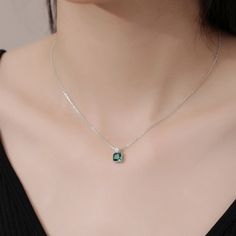 This exquisite pendant necklace showcases a brilliant emerald in a classic solitaire setting, radiating a lush green hue. Its elegant simplicity makes it a standout piece, perfect for enhancing any neckline with a touch of refined sophistication. Emerald Necklace In Brilliant Cut, Green Brilliant Cut Necklace For May Birthstone, Fine Jewelry Emerald Necklace With Brilliant Cut, Fine Jewelry Green Emerald Necklace With Brilliant Cut, Green Emerald-cut Diamond Necklace, Green May Birthstone Necklace In Fine Jewelry Style, Green Fine Jewelry Necklace For May Birthstone, Green Fine Jewelry Necklace For Formal Occasions, Elegant Green Emerald Necklace With Diamond Cut