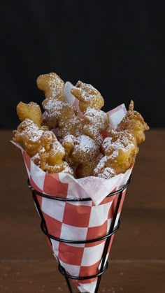 funnel cake fries in a basket with text overlay that reads funnel cake frieds