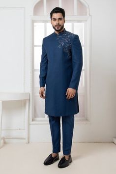 Royal blue suiting fabric bandhgala with placement motif embroidery. Paired with a straight pant. - Aza Fashions Blue Bandhgala With Intricate Embroidery For Formal Occasions, Luxury Blue Bandhgala With Naqshi Detail, Elegant Blue Bandhgala With Intricate Embroidery, Formal Blue Bandhgala With Intricate Embroidery, Fitted Blue Bandhgala With Intricate Embroidery, Motif Embroidery, Suiting Fabric, Band Collar, Straight Pants