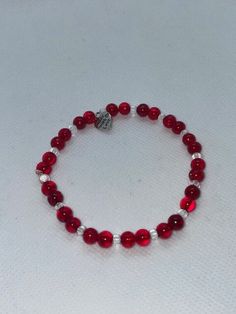 Red rounded beads complimented with clear rounded beads perfect for Valentines day. 20cm circumference 6.3cm diameter made with clear stretchy string. Can be made to any size on request. Will receive item in a gift bag. Handmade Clear Beaded Bracelets As Gift, Clear Beaded Bracelets As A Gift, Clear Beaded Bracelets For Gift, Clear Beaded Stretch Bracelet As Gift, Adjustable Clear Stretch Bracelet As A Gift, Faceted Beads Stretch Bracelet Gift, Red Adjustable Crystal Bracelet For Valentine's Day, Adjustable Red Crystal Bracelet For Valentine's Day, Red Faceted Bead Bracelets As Gift