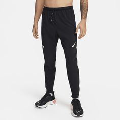 a man in black nike pants and no shirt