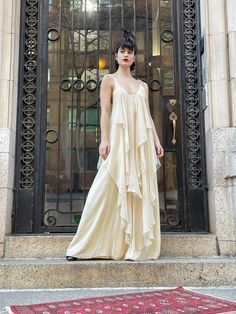 70s silk Cream color chiffon layers on both front and back, absolutely fabulous gown Grecian style with butterfly print, silk tie on shoulder can be adjust Made in England. Bust 15" Length 59" Waist open. good vintage condition.  Etsy Shipping Please read -Vintage and pre-owned items may have signs of wear and use and are offered as is. Traces of age and use are therefore completely normal and do not constitute defects. Please see pictures as they are part of the item description and refer to sizes/measurements provided. measurements are taken Flat, double for circumference. Please contact me if you want more information and/or pictures.  All sales are final.  -I do NOT offer cancellation, redemption or exchange. -Combined shipping with other articles is possible; please contact me for an Spring Gala Pre-draped Maxi Dress, Flowy Silk Pre-draped Maxi Dress, Summer Wedding Pre-draped Maxi Dress, Spring Silk Chiffon Maxi Dress, Spring Silk Chiffon Maxi Dress For Daywear, Spring Flowy Silk Chiffon Maxi Dress, Flowy Silk Chiffon Maxi Dress For Spring, Chic Silk Gown With Ruffles, Summer Silk Gown With Ruffles