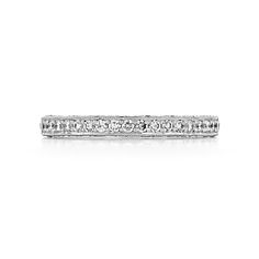 This perfectly named Tacori Blooming Beauties wedding band blossoms into a gorgeous arrangement of detail and diamonds, guaranteed to captivate your beloved with its striking nature. A classic platinum band holds a captivating string of pavé-set diamonds, while astonishing reverse crescents glisten along the inner face of this women's band. This blooming diamond band will serve as a constant reminder of your ever flourishing devotion to one another. Classic Platinum Eternity Band For Wedding, Timeless Eternity Band For Wedding With Lab Grown Diamond, Timeless Wedding Eternity Band With Lab Grown Diamond, Classic White Gold Eternity Band For Wedding, Timeless Lab Grown Diamond Eternity Band For Wedding, Classic White Gold Wedding Eternity Band, Timeless White Gold Wedding Bands, Luxury Brilliant Cut Eternity Band For Wedding, Wedding Eternity Band With Diamond Cut Lab Grown Diamond