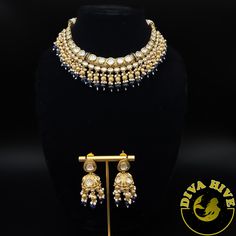 Beautiful Polki kundan hasli style necklace with jhumka Elevate your style with the exquisite Diva necklace and earring set, exclusively available at our luxury Indian jewelry store. Made with the finest materials, this set is a true reflection of Elegance and glamour, designed to take your look to new heights. Each piece in the set is meticulously crafted to ensure superior quality and attention to detail. The necklace and earring set is the perfect addition to your collection offering versatil Diwali Designer Jewelry With Latkans, Designer Kundan Necklace With Latkans, Designer Chandbali Necklaces For Diwali, Bollywood Designer Jewelry Sets For Diwali, Kundan Jewelry Sets For Diwali, Dual-tone Kundan Chandbali Bridal Necklace, Dual-tone Chandbali Kundan Bridal Necklace, Kundan Chandbali Jewelry Sets For Designer Wear, Bollywood Style Kundan Bridal Necklace In Dual-tone