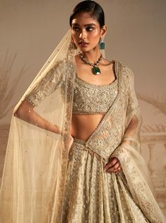 Unveil the allure of this silver green lehenga set, adorned with persian-inspired tree motifs symbolizing growth. This captivating ensemble, featuring a lehenga, blouse and dupatta is your ticket to turning heads at any occasion. Elegant Pista Green Set With Cutdana Detailing, Elegant Pista Green Set With Cutdana, Semi-stitched Silver Anarkali Set For Festivals, Traditional Silver Sharara For Designer Wear, Bollywood Style Silver Saree Dress, Silver Dress For Diwali Festival, Silver Traditional Wear With Intricate Embroidery For Festive Season, Festive Silver Traditional Wear With Intricate Embroidery, Silver Anarkali Dress For Diwali