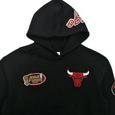 Represent the Chicago Bulls in style with The City Collection pullover hoodie by Mitchell & Ness. Features clean graphics, minimal team color palettes, and high-quality embroidery.Features: 80% cotton/20% polyester fleece, 275GSM Hood is lined in cotton jersey 1x1 rib trim at cuffs, waistband and pocket binding Embroidered felt logos on chest and sleeves Screen print graphics on back body and hood Mitchell & Ness script embroidery on right cuff Tailored fit: This style fits a bit trimmer in the Black Tops With Drawstring Hood For Sports Events, Black Fleece Hoodie For Sports Events, Black Branded Hoodie In Athleisure Style, Black Sportswear Hoodie For Sports Events, Black Hoodie With Drawstring For Sports Events, Black Hoodie Sweatshirt For Sports Events, Black Sporty Hoodie For Sports Events, Black Athleisure Hoodie For Sports Events, Black Winter Sweatshirt For Sports Events