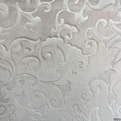 an upholstered fabric with white swirls on it