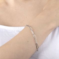 Add a trendy look to your jewelry collection by adding this Silver Reflections pure silver over brass paperclip chain bracelet. This bracelet is crafted in pure silver over brass, available in 7.5 inch length, has a semisolid paperclip chain construction and features a lobster clasp closure for a safe and comfortable wear. If you're looking for the perfect trendy chain bracelet for stacking or to wear alone, this bracelet is just what your jewelry collection needs! Wipe bracelet clean with a sof Silver Paperclip Bracelet With Rectangular Links For Formal Occasions, Silver Paperclip Bracelet With Oval Links For Formal Occasions, Silver Paperclip Chain Bracelet For Formal Occasions, Formal Silver Bracelet With Paperclip Chain, Formal Silver Paperclip Bracelet With Oval Links, Formal Silver Sterling Silver Paperclip Bracelet, Formal Silver Paperclip Chain Bracelet, Modern Sterling Silver Paperclip Bracelet With Oval Links, Modern Silver Paperclip Bracelet With Oval Links