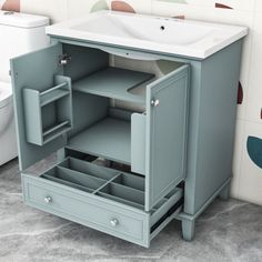 a bathroom vanity with drawers and a sink