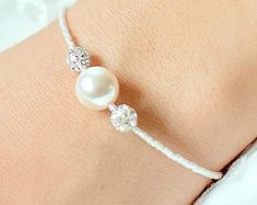 Bridal bracelet Lea Pearl bridal bracelet bridal jewelry | Etsy Wedding Pearl White Beaded Bracelets, Pearl Beaded Bracelets With Pearl Charm For Wedding, Adjustable Pearl Embellished Bracelet For Wedding, White Pearl Embellished Bracelets For Wedding, Wedding Bracelet With Pearl Drop, Pearl Drop Bracelet For Wedding, Wedding Pearl Bracelet With Beaded Details, Adjustable Pearl Drop Bracelet For Weddings, White Pearl Beaded Bracelet For Wedding