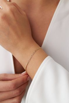 Our new simple and dainty Figaro chain bracelets, as always made in 14k solid gold. You can wear this bracelet with a free mind without worrying about water, perfume, or conditioner contact since real gold never tarnishes.★ Features of the Bracelet (this listing is for a single bracelet only)• Gold Kt: 14K Solid Gold (all pieces are stamped for authenticity)• Available Gold Color: Yellow Gold• Chain Width: 2.5 mm Single Bracelet, Gold Diamond Earrings Studs, Statement Rings Diamond, Diamond Huggies, Solid Gold Bracelet, Ruby Bracelet, Water Perfume, Diamond Stacking Rings, Emerald Bracelet