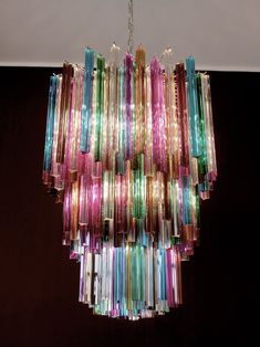 a multicolored chandelier hanging from a ceiling