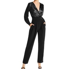 Lini Stella Sequined Embellished Jumpsuit Long Sleeve In Black Size Xs New With Tag Very Nice And Easy To Style Jumpsuit. Perfect For Any Type Of Special Occasion. Would Look Great With Pumps Or Heels. Deep V-Neck Long Sleeves Button Cuffs Sequined Bodice Elastic Back Waistband Side Seam Pockets Front Pleats At Waist Hidden Zip And Hook Closure Dry Clean 79% Polyester, 12% Viscose, 10% Elastane Lining: 100% Polyester Please See Pictures For Approx Measurements Laying Flat. This Item Is Coming Fr Elegant Long Sleeve Embellished Jumpsuits, Sequined Jumpsuit, Elegant Pants Suits, Black Sequin Jumpsuit, Tuxedo Jumpsuit, Embellished Jumpsuit, Elegant Pant, Sequin Jumpsuit, Jumpsuit Elegant