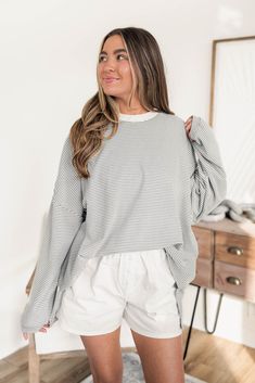 Get cozy in the Polly Striped Oversized Top! With its playful striped print and relaxed fit, this top is perfect for lounging in style. Pair with your favorite leggings or jeans for a laid-back look. Model is 5’4 wearing a size small S/M 2-6, M/L 8-12 Oversized fit Striped print Contrast crew neckline Long sleeves Trendy Striped Hem Tops For Fall, Trendy Fall Tops With Striped Hem, Oversized Tops With Striped Hem For Spring, Oversized Top With Striped Hem, Spring Oversized Top With Striped Hem, Fall Striped Hem Top For Loungewear, Oversized Spring Top With Striped Hem, Oversized Striped Hem Tops For Spring, Comfy Oversized Everyday Tops