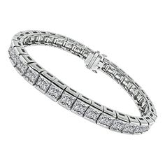 This is a stunning platinum bracelet. The bracelet is set with sparkling princess cut diamonds that weigh approximately 22.00ct. The color of these diamonds is F-G with VVS1-VVS2 clarity. The bracelet measures 7 inches in length and 7mm in width. The bracelet weighs 43.8 grams. Inventory #59900AWSSS Platinum Bracelet, Bracelet Tennis, Princess Cut Diamonds, Tennis Bracelet, Princess Cut, Diamond Cuts, Platinum, Jewelry Bracelets, Sparkle