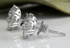 Exquisite 1.60 Carats Natural VVS Diamond 14K Solid White Gold Stud Earrings Amazing looking piece! Suggested Replacement Value $5,800.00 Total Natural Round Cut Diamonds Weight: 1.60 Carats (both earrings) VS1-VS2 / G-H Diameter of the Earring is: 9mm Total Earrings Weight is: 2.1 grams Disclaimer: all weights, measurements and colors are approximate and may vary slightly from the listed dimensions or as seen in the image. All pictures are magnified to show the smallest of details. Please, refe Luxury Cluster Earrings With Vvs Clarity For Anniversary, Luxury Vvs Clarity Cluster Earrings For Anniversary, Luxury Cluster Earrings For Anniversary, Luxury Round Cut Cluster Earrings For Anniversary, Luxury Cluster Earrings With Prong Setting For Anniversary, Luxury Brilliant Cut Cluster Earrings For Anniversary, Luxury Cluster Diamond Earrings For Anniversary, Luxury Diamond Cut Cluster Earrings For Anniversary, Luxury Diamond Accented Cluster Earrings For Anniversary