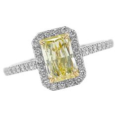 Crafted from Platinum the magnificent engagement ring comes enriched with 1.36 carats Cut-Cornered Rectangular Fancy Yellow Diamond Clarity SI1 GIA #6187262843 with Yellow Gold Settings and 50 Pave Diamonds 0.41 carats Split Shank. Size 6. Perfect High Jewelry Gift for Mom, Girlfriend, Daughter, Birthday or Christmas Gift. Gia Certified Square Cut Ring For Formal Occasions, Luxury Emerald Cut Diamond Ring With Halo Design, Yellow Emerald Cut Diamond Ring, Gia Certified Radiant Cut Ring For Formal Events, Emerald Cut Halo Diamond Promise Ring, Gia Certified Square Cut Diamond Ring For Anniversary, Yellow Diamond Ring With Emerald Cut, Platinum Diamond Ring With Halo Design In Yellow Gold, Anniversary Radiant Cut Diamond Halo Ring