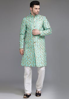 Ready-made Art Silk Sherwani in Turquoise Color. Crafted in Chinese Collar and Full Sleeves, this Ready-made attire with Satin Lining is Enhanced with Buttons, Pockets, Sequins and Zari Work. Available with a Art Silk Pant in White Color.   Do note: Footwear, Stole and Kanthimala shown in the image is for presentation purposes only. Half to one inch may vary in measurement. (Slight variation in actual color vs. image is possible)           We sell all kinds of menswear. Mens Sherwani | Art Silk Green Bollywood Bandhgala With Chikankari Embroidery, Green Semi-stitched Bandhgala With Resham Embroidery, Green Sherwani With Zari Work Straight Kurta, Green Sherwani With Zari Work, Straight Kurta Style, Green Sherwani With Zari Work, Designer Green Bandhgala With Chikankari Embroidery, Green Bollywood Nehru Jacket With Zari Work, Bollywood Style Green Nehru Jacket With Zari Work, Green Bandhgala With Traditional Drape