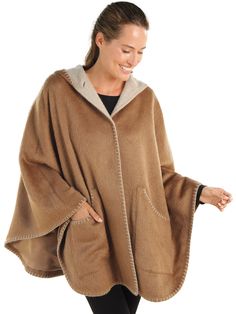 Experience true designer quality without the designer price tag. This luxurious satin-lined cape, 70% suri alpaca and 30% merino wool, wraps you in a cozy all-day caress. Contrasting light and dark Brown interior/exteriors and standout stitching at the edges add striking definition and pique interest—attracting compliments wherever you go. We’ve even added generous pockets so you can mingle with all your essentials. Made in Peru. Elegant Wool Poncho Shawl, Elegant Wool Shawl Poncho, One Size Wool Cape, Cozy Cashmere Cape, One Size Wool Cape Outerwear, Cozy Wool Poncho Cape, Cozy Alpaca Poncho Cape, Alpaca Shawl Cape For Fall, Fall Alpaca Shawl Cape