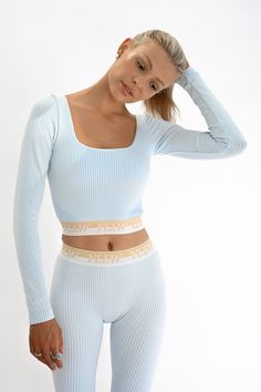 The Isa Ribbed Long Sleeve features sleek long sleeves, low back, and square neck in our signature ribbed fabric. The soft to touch fabric has the perfect stretch and comfort for the colder active days. Pair with the Cora Leggings and Aly Shorts for the full set. Lined Removable padding Fitted long sleeves Heavyweight rib Layered sky blue and white ribbed fabric YLLW custom trim in white and gold 57% nylon, 37% polyester, and 6% spandex Your order will ship from our warehouse in FL, USA! Workout Legging, Workout Fits, Ribbed Leggings, Whimsical Fashion, Sporty Girls, Squat Proof, Summer Fashion Outfits, Character Outfits, Ribbed Fabric