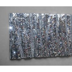 a piece of art that is made out of silver sequins