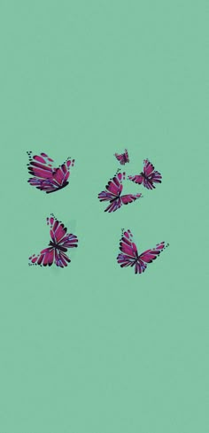 four pink butterflies flying in the sky