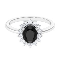 Product Details Youll adore the timeless design of this Princess Diana inspired ring, featuring an oval-shaped Black Onyx as the main stone and a halo of round Diamond. This Black Onyx Ring emanates a luxurious look. Product Information SKU SHP-RINGS0821231760 Width 4 mm Height 11 mm Weight 2.56 gm (Approximate) BLACK ONYX INFORMATION No.of Stones 1 Pieces Total Weight 1.10 Carat (Approximate) Dimension(approx) Oval-6X8 mm-1 Pcs Color Black Cut Brilliant Shape Oval Setting Type Prong-Setting Qua Diana Ring, Black Onyx Engagement Ring, Onyx Engagement Ring, Oval Setting, Black Engagement Ring, Black Diamond Ring Engagement, Engagement Ring Diamond, Black Onyx Ring, 18k Yellow Gold Ring