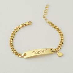 "Personalized this adorable baby bracelet with your kid's name on the bar and a cute charm of your choice, making a great gift idea for special occasions such as the first birthday, baptism and many more! ► PERSONALIZED KID NAME BRACELET WITH CHARM * Pendant measures approx: 32x6,5mm * By default, silver items comes with BLACK engraving and gold-plated item comes with CLEAR engraving. * Age group bracelet size recommendation: Newborn to 6 months - XXS: bracelet's circumference (includes opening) is 4\" 6 to 12 months - XS: bracelet's circumference (includes opening) is 4.5\" 12 to 24 months - S: bracelet's circumference (includes opening) is 5\" 2 to 5 years - M: bracelet's circumference (includes opening) is 5.5\" 6 to 8 years - L: bracelet's circumference (includes opening) is 6\" 9 to13 Custom Name Bracelet For Valentine's Day, Valentine's Day Personalized Name Bracelet, Customizable Nameplate Charm Bracelet For Personalized Gift, Customizable Nameplate Charm Bracelet As Personalized Gift, Cute Personalized Heart Bracelet For Birthday, Personalized Nameplate Bracelet For Valentine's Day, Valentine's Day Nameplate Bracelet For Personalized Gift, Dainty Personalized Nameplate Bracelet, Valentine's Day Nameplate Name Bracelet