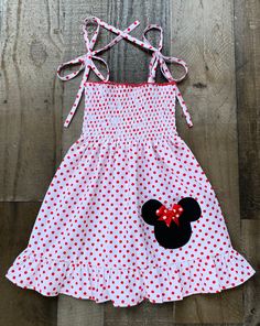 White Red Polka Dot Minnie Mouse Dress Playful Minnie Mouse Summer Dress, Minnie Mouse Fitted Sleeveless Dress, Minnie Mouse Sleeveless Fitted Dress, Sleeveless Minnie Mouse Dress For Spring, Spring Casual Minnie Mouse Dress, Casual Minnie Mouse Summer Dress, Red Fitted Minnie Mouse Dress, Casual Summer Dress With Minnie Mouse Design, Red Fitted Cotton Smocked Dress