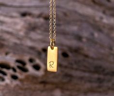 Set of 2 smooth 14k solid gold initials on one necklace. Rectangular tiny tags available in 14k solid yellow, white or 18k rose gold and can be bought mixed as well. The tag is stamped by hand. You can choose the charms with a 14k solid gold dainty chain or without a chain. You can choose between a charm with an initial, symbol, number or a blank charm. Please note your font (last picture) and letter choices in the note to seller box at check out. The pendant is 13mm long and 5mm wide. You can c Minimalist 14k Gold Hand Stamped Charm Necklace, Elegant 14k Gold Hand Stamped Necklaces, Elegant 14k Gold Necklace With Hand Stamped Details, Elegant 14k Gold Necklace Hand Stamped, Minimalist Yellow Gold Hand Stamped Charm Necklace, Minimalist Personalized Charm Necklaces In Recycled Gold, Minimalist Personalized Charm Necklace In Recycled Gold, Minimalist Yellow Gold Initial Necklace For Personalized Gift, Minimalist Yellow Gold Hand Stamped Necklace