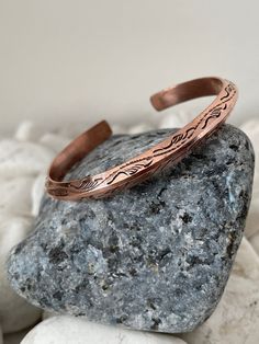 "Discover our beautiful and unique Handmade Pure Copper Bracelet from Nepal 🌍✨Crafted with love by skilled Nepali artisans whom we work closely with to bring our vision to life, these timeless accessories are simple yet exquisite. Add a touch of charm to your wrist with this special copper bracelet, carefully crafted by talented artisans in Kathmandu Nepal. The beautiful detailing and warm copper tones make it a timeless accessory that goes with any outfit. Wear a piece of Nepal's craftsmanship Handmade Rose Gold Copper Cuff Bracelet, Copper Bangle Bracelets As Gift, Copper Bangle Bracelets For Gifts, Adjustable Nature-inspired Bangle As A Gift, Adjustable Copper Artisan Cuff Bracelet, Artisan Copper Cuff Bracelet Adjustable, Artisan Copper Cuff Bracelet With Adjustable Fit, Artisan Adjustable Copper Cuff Bracelet, Adjustable Artisan Copper Cuff Bracelet