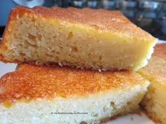 two pieces of cake sitting on top of a white plate