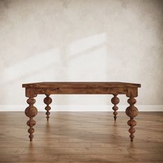 a wooden bench sitting on top of a hard wood floor next to a white wall