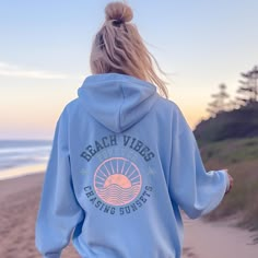 Embrace the retro summer vibes with our Beach Vibes Forever Chasing Sunsets hoodie, perfect for the eternal sunset chaser in you! This trendy unisex sweatshirt is designed for the summer lover who can't resist the allure of chasing sunsets at the beach. The words Forever chasing on the back add a cool and laid-back touch, making it a must-have for any surfer or sunset lover. Made with a cozy blend of cotton and polyester, this hoodie will keep you warm and stylish no matter the weather. Get ready to rock the retro beach look with this summer-saying sweatshirt that exudes endless summer vibes. Designed with style and comfort in mind, this hoodie will quickly become your new favorite. It's made from soft fleece inside and outside, with a sturdy metal zipper, convenient front pockets, and a h Trendy Letter Print Sweatshirt For Beach, Summer Vacation Cotton Hoodie, Trendy Sweatshirt For Beach In Spring, Trendy Spring Beach Sweatshirt, Cotton Hoodie For Summer Vacation, Summer Casual Hoodie With Letter Print, Summer Hoodie Sweatshirt With Letter Print, Summer Letter Print Hoodie Sweatshirt, Casual Beach Season Hoodie Tops