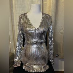 Brand New Without Tags ! Metallic Long Sleeve Mini Dress With Sequins, Metallic Long Sleeve Sequin Mini Dress, Metallic Long Sleeve Shiny Dress, Metallic Shiny Long Sleeve Dresses, Glamorous Long Sleeve Shiny Mini Dress, Metallic Long Sleeve Sequin Dress For Night Out, Silver Fitted Long Sleeve Mini Dress, Silver Shiny Sequin Evening Dress, Silver V-neck Sequin Party Dress