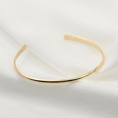 "14K gold cuff bracelet. 14K Gold Minimalist Cuff Bracelet, Delicate cuff bracelet. The bracelet will be shipped in a gift box * 14K solid gold. It is about 2.5mm width. Please select the size of your wrist. If your wrist is 6\", please purchase a 6\" bracelet. (If you order a 6\" bracelet, actual cuff length will be 5\" plus 1 inch opening.) Please read our policies before you place your order. https://www.etsy.com/shop/SashJewelry/policy?ref=shopinfo_policies_leftnav To see other Mother daught Elegant Gold Bracelet With Open Band, Adjustable Gold Cuff Bracelet For Everyday Luxury, Elegant Gold Open Band Bangle, Gold Open Band Bangle Gift, Gold Open Cuff Elegant Jewelry, Elegant Everyday Luxury Cuff Bangle Bracelet, Elegant Gold Open Cuff Jewelry, Elegant Cuff Bangle As A Gift, Luxury Open Band Cuff Bracelet As Gift