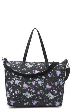 Pack up for your next getaway in style in this sleek tote bag. 13" H x 17" W x 7.5" D; 10" handle drop; 10-20" shoulder strap drop Dual top handles Single detachable, adjustable shoulder strap Top zip closure Exterior features front zip pocket Interior features 1 wall zip pocket and 2 wall slip pockets Polyester and PU trim exterior, polyester lining Imported On-the-go Laptop Bag With Detachable Double Handle, Travel Tote Shoulder Bag With Detachable Strap, Travel Tote Shoulder Bag With Adjustable Strap, Travel Tote Satchel With Adjustable Strap, Travel Satchel With Adjustable Strap And Tote Shape, Travel Satchel With Double Handle, Trendy Laptop Bag With Adjustable Strap For On-the-go, Travel Shoulder Bag With Double Handle, Travel Laptop Bag With Adjustable Strap And Top Handle