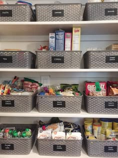 the shelves are filled with plastic containers and food