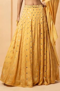 Gold attached cancan lehenga with mirror, bead, pearl embellishment. Paired with halter neck embellished padded blouse and dupatta. - Aza Fashions Sleeveless Embellished Lehenga For Festivals, Festive Anarkali Embellished Skirt, Sleeveless Traditional Wear With Mirror Work For Party, Festive Floor-length Embellished Skirt, Embellished Floor-length Festive Skirt, Festive Embellished Traditional Drape Skirt, Festive Embellished Wedding Skirt, Anarkali Skirt With Mirror Work For Reception, Traditional Skirt With Mirror Work For Reception