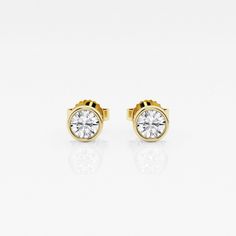 If you can't travel to Europe, then bring these classic European styled studs to you! These earrings have beautiful round lab grown diamonds set in a classic bezel setting. De rien?you're welcome! 14k Gold Diamond Earrings With Bezel Setting, Yellow Gold Diamond Earrings With Bezel Setting, Classic 14k Gold Earrings With Bezel Setting, Classic Yellow Gold Diamond Earrings With Bezel Setting, Classic 14k Gold Diamond Earrings With Bezel Setting, Timeless Round Diamond Earrings With Bezel Setting, Gold Round Cut Diamond Earrings With Bezel Setting, Classic Yellow Gold Earrings With Bezel Setting, Gold Diamond Earrings With Bezel Setting